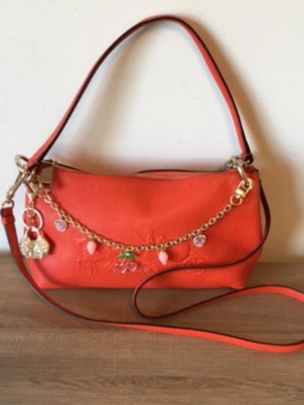 Coach Orange Crossbody Bag with Gold Chain Charm